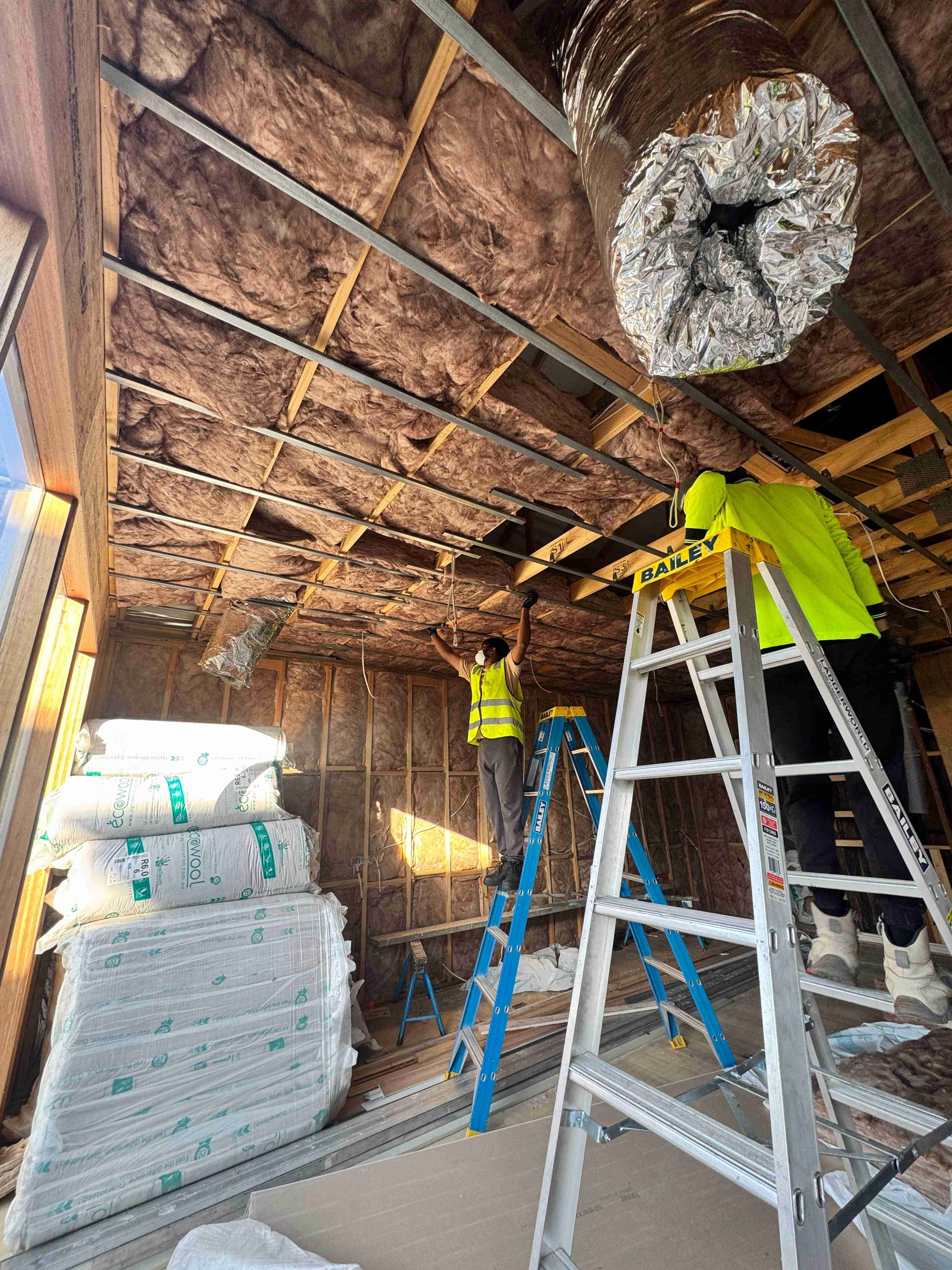 Ceiling insulation batts installed between roof joists